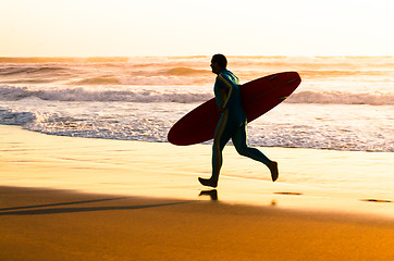 Image showing Surfer running