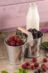 Image showing Metal buckets with fresh berries