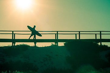 Image showing Surfer running to the beach