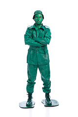 Image showing Man on a green toy soldier costume