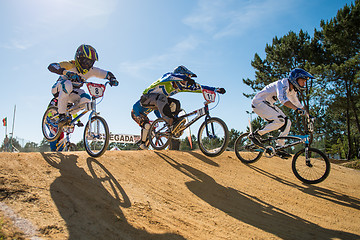 Image showing Elite riders jumping