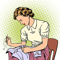 Image showing woman sews shirt thread housewife housework comfort