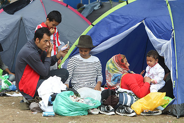 Image showing Syrian refugees resting in tent