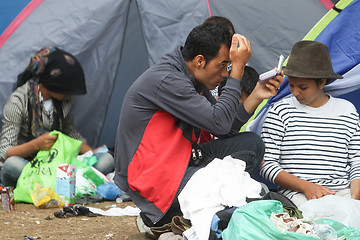 Image showing Man fixing his hair 