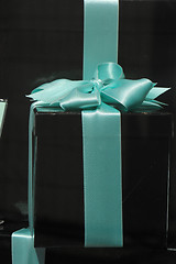 Image showing Gift box with blue ribbon