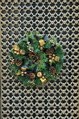 Image showing Classic christmas wreath with decorations on a door