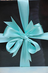 Image showing Gift box with blue ribbon