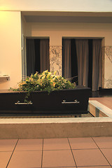 Image showing Funeral flowers on a casket