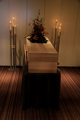 Image showing Wooden casket in funeral home