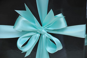 Image showing Gift box with blue ribbon