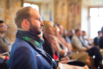 Image showing Entrepreneur in audience at business conference.