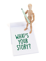 Image showing Wooden mannequin writing - What\'s your story