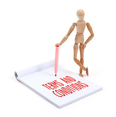 Image showing Wooden mannequin writing - Terms and conditions