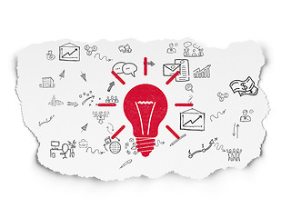 Image showing Finance concept: Light Bulb on Torn Paper background