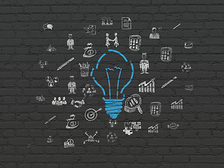 Image showing Finance concept: Light Bulb on wall background