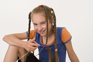 Image showing Girl with a mediaplayer I