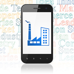 Image showing Business concept: Smartphone with Industry Building on display