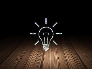 Image showing Business concept: Light Bulb in grunge dark room