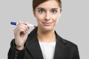 Image showing Businesswoman drawing on a glass board