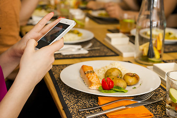 Image showing Taking a picture of the food