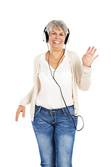 Image showing Elderly woman listen music