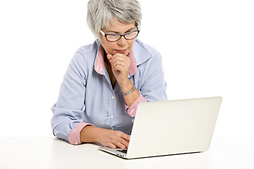 Image showing Ellderly woman working with a laptop