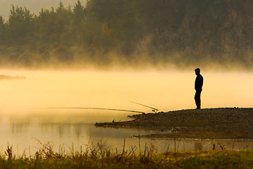 Image showing Man Fishing at river shore