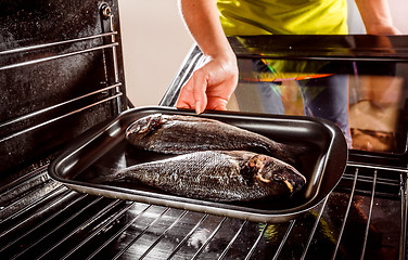 Image showing Cooking Dorado fish in the oven.