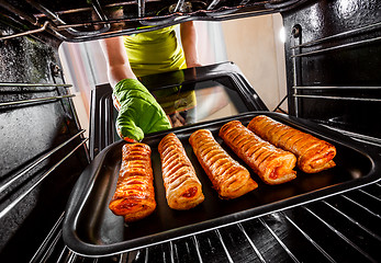 Image showing Cooking in the oven at home.