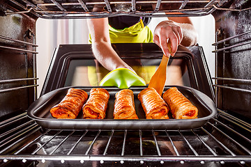 Image showing Cooking in the oven at home.