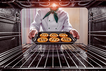 Image showing Chef cooking in the oven.