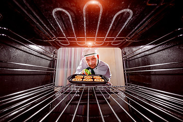 Image showing Chef cooking in the oven.