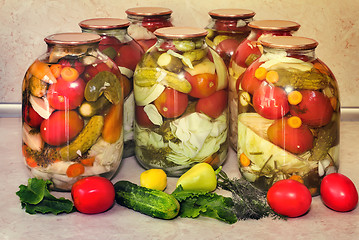 Image showing  A variety of canned vegetables in glass jars.