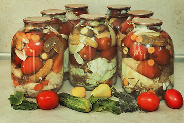 Image showing  A variety of canned vegetables in glass jars.