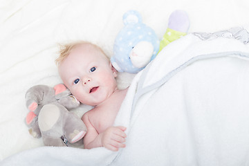 Image showing Baby with plush toy.