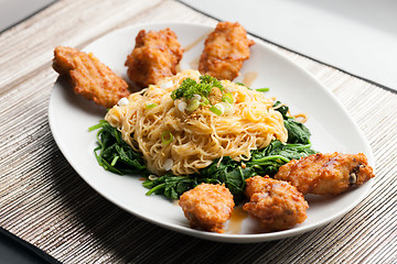 Image showing Chicken Wings with Noodles and Spinach