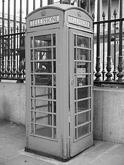 Image showing Black and white Red phone box in London