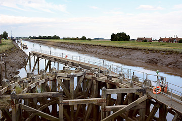 Image showing Approach on River Nene at low tide to Crosskeys Bridge at Sutton
