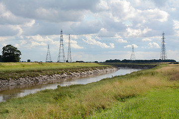 Image showing Overhead power lines span the River Nene in Cambridgeshire