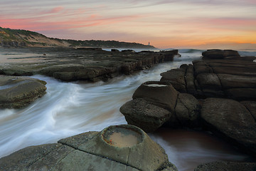 Image showing Ocean flowing in and out of the rock chasm Norah Head