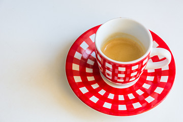 Image showing Red striped cup of coffee
