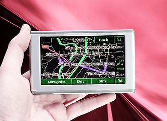 Image showing GPS Vehicle navigation system in a man hand.