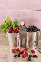 Image showing Metal buckets with fresh berries