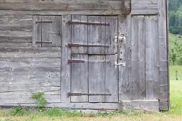 Image showing Old door in a wooden shed