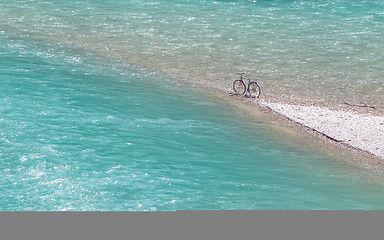 Image showing Bike parked at an impossible spot, middle of a river