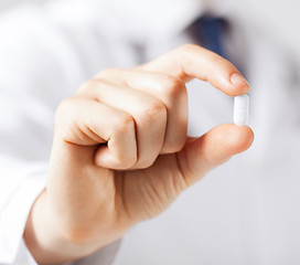 Image showing doctor with pill in hospital