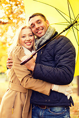 Image showing smiling couple hugging in autumn park