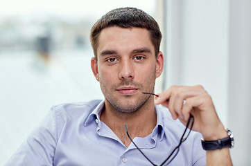 Image showing portrait of businessman with eyeglasses at office