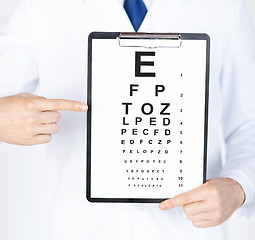 Image showing male ophthalmologist with eye chart