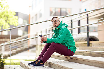 Image showing young hipster man with smartphone in city